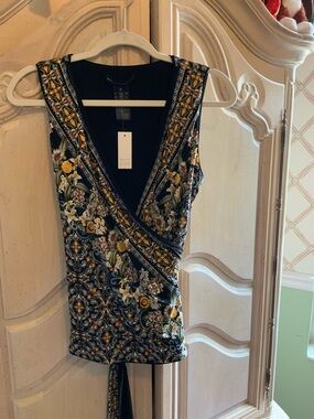 NWT Medium White House Black Market Wrap Top in Black with Yellow Accents.